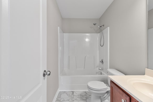 full bathroom with baseboards, toilet, vanity, shower / tub combination, and marble finish floor
