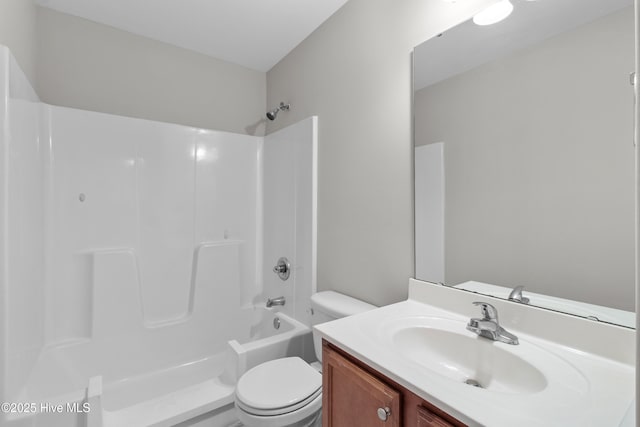 full bathroom with toilet and vanity