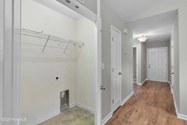 laundry area with light wood-style flooring, electric dryer hookup, baseboards, and laundry area