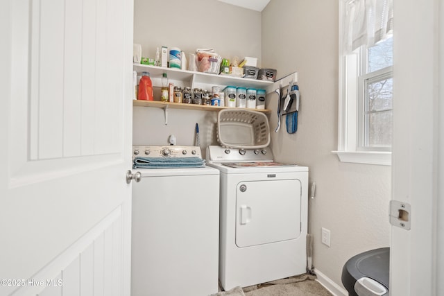 washroom with washer and dryer