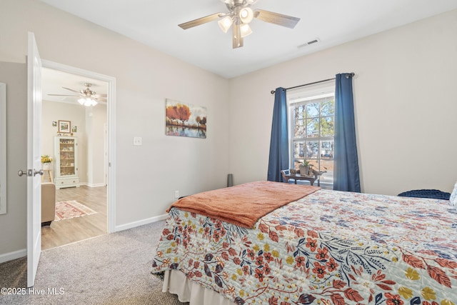 bedroom featuring ceiling fan and carpet