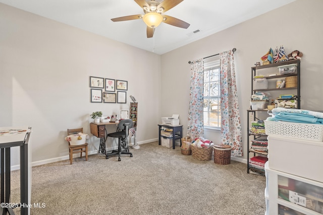 office area with ceiling fan and carpet