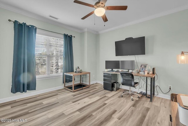 office space featuring crown molding, light hardwood / wood-style floors, and ceiling fan