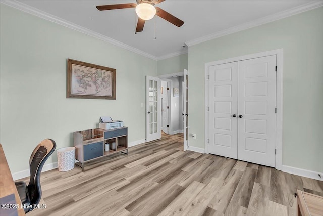 home office featuring ornamental molding, ceiling fan, and light wood-type flooring