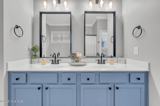 bathroom featuring vanity, crown molding, and a shower with curtain