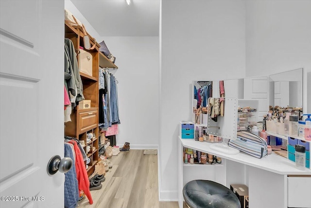 spacious closet featuring light hardwood / wood-style flooring