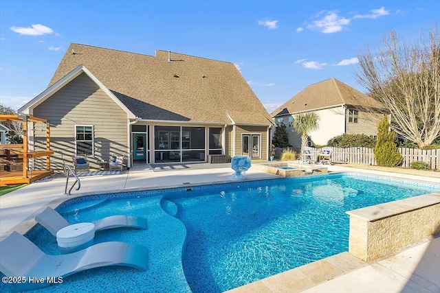 view of pool featuring a patio and a sunroom