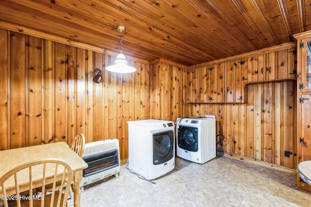 washroom with wood ceiling, independent washer and dryer, heating unit, and wood walls