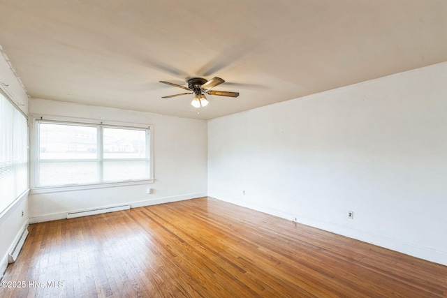 empty room with baseboard heating, ceiling fan, and wood-type flooring