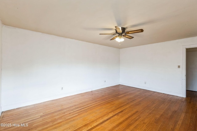 unfurnished room featuring hardwood / wood-style flooring and ceiling fan