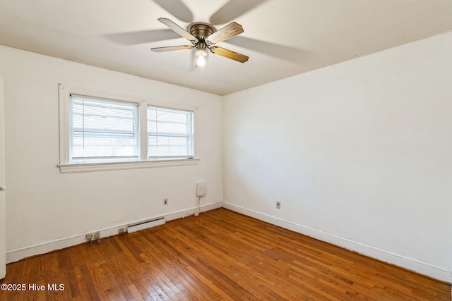 spare room with wood-type flooring and ceiling fan