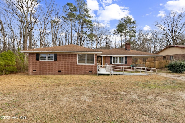 single story home with a wooden deck and a front yard