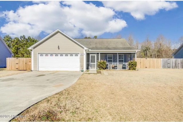 ranch-style house with concrete driveway, an attached garage, fence, and a sunroom