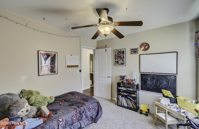 bedroom with ceiling fan and carpet floors