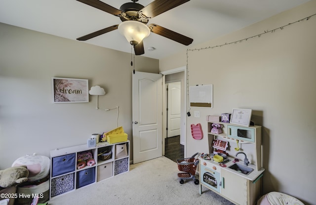 game room featuring carpet floors and ceiling fan