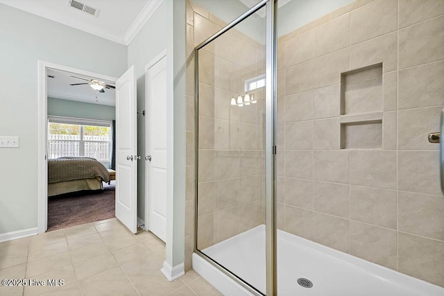 bathroom with ornamental molding, a shower with shower door, tile patterned floors, and ceiling fan