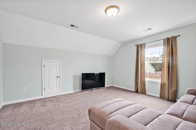 carpeted living room with lofted ceiling