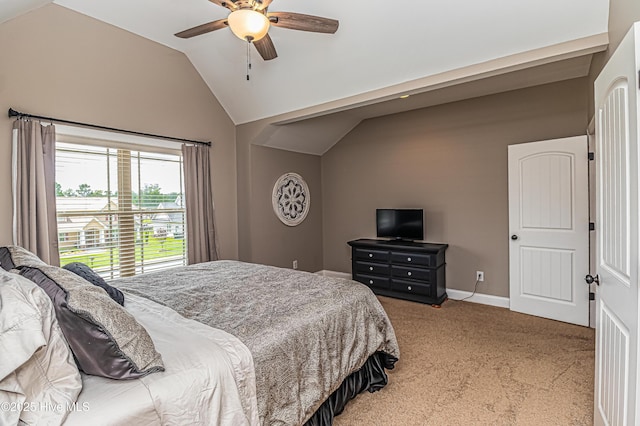 bedroom featuring vaulted ceiling, ceiling fan, and carpet flooring