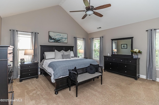 bedroom with ceiling fan, light colored carpet, and high vaulted ceiling