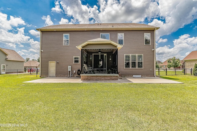 back of house with a lawn, ceiling fan, and a patio area