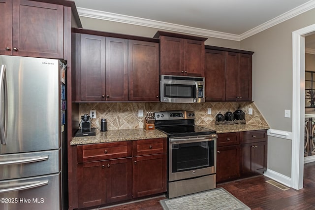 kitchen featuring dark hardwood / wood-style floors, tasteful backsplash, stainless steel appliances, crown molding, and light stone countertops