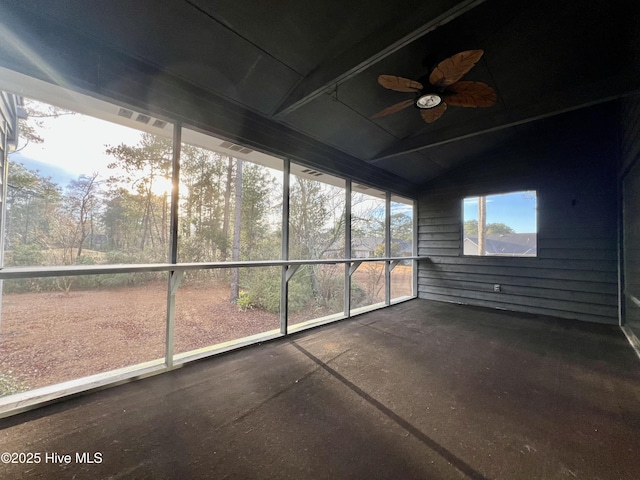 unfurnished sunroom featuring vaulted ceiling and ceiling fan