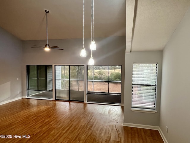 unfurnished room featuring hardwood / wood-style flooring and ceiling fan