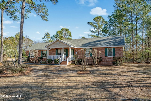 ranch-style house featuring covered porch