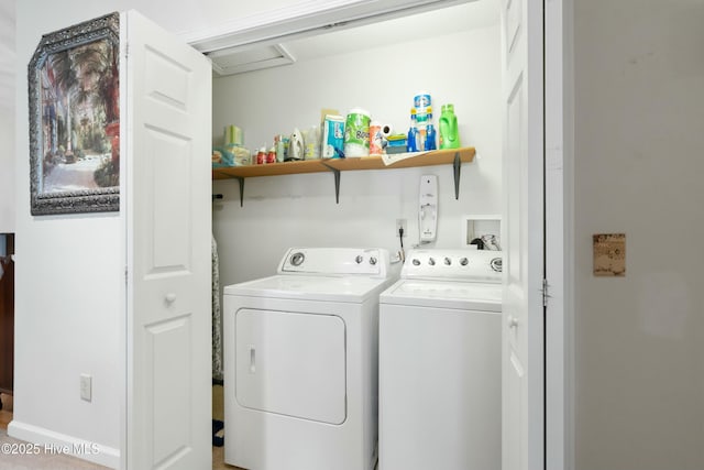 laundry room featuring separate washer and dryer