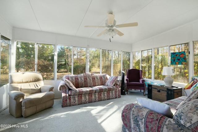 sunroom / solarium featuring ceiling fan