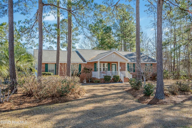 ranch-style house featuring covered porch