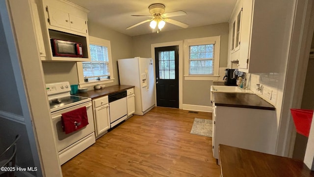 kitchen with white cabinetry, white appliances, ceiling fan, and light hardwood / wood-style floors