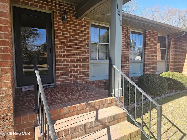 view of exterior entry with a porch