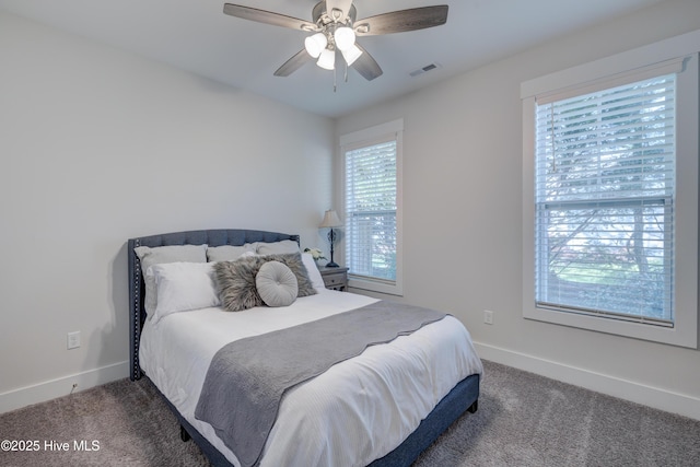 bedroom featuring ceiling fan and dark colored carpet