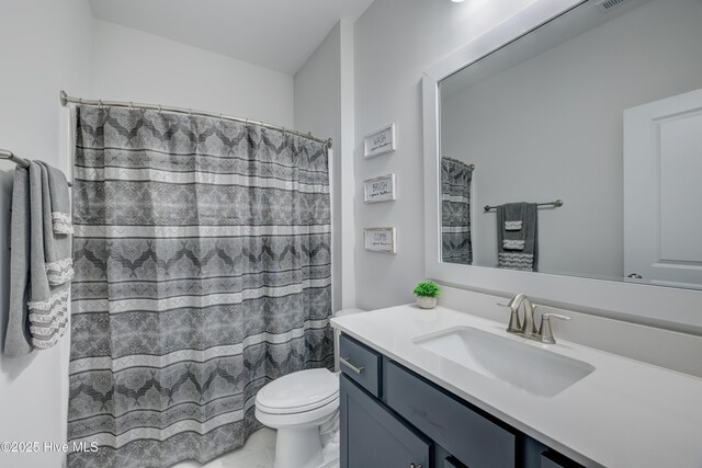 332 Grandview Dr, Hampstead, NC 28443 - bathroom featuring visible vents, curtained shower, toilet, and vanity