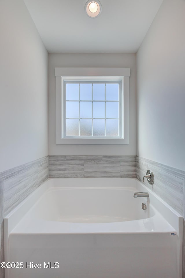 bathroom with a washtub