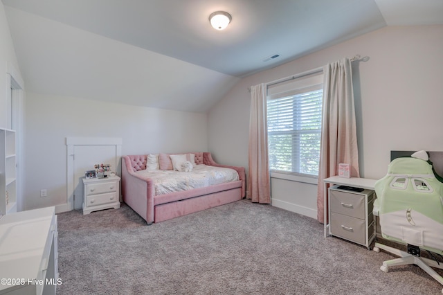 carpeted bedroom with vaulted ceiling