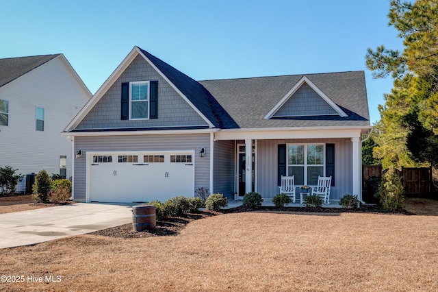 view of front of home with a garage and covered porch