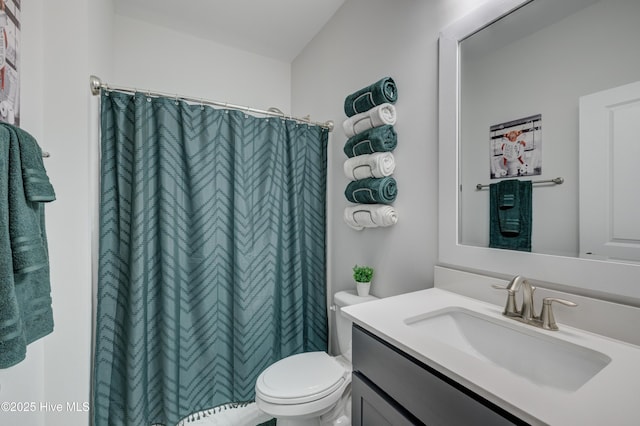 bathroom with a shower with curtain, vanity, and toilet