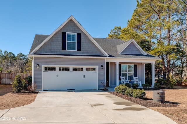 view of front of house with a garage and covered porch