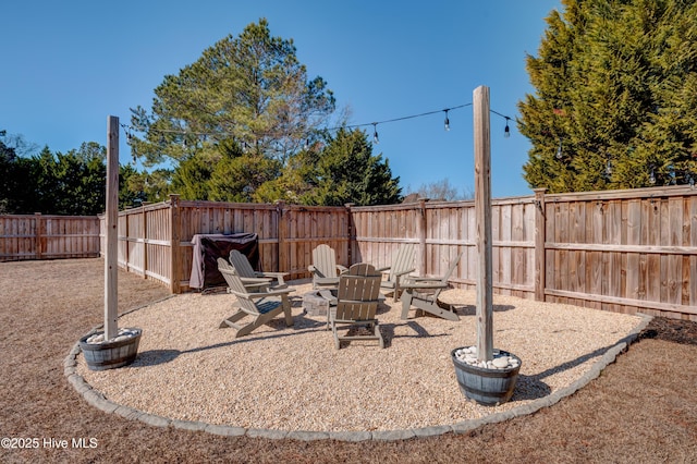 view of yard with a fire pit