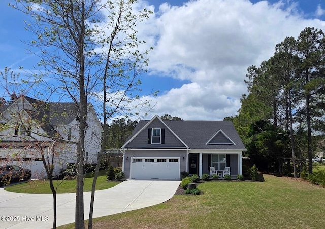 332 Grandview Dr, Hampstead, NC 28443 - view of front of home featuring covered porch, driveway, a garage, and a front lawn