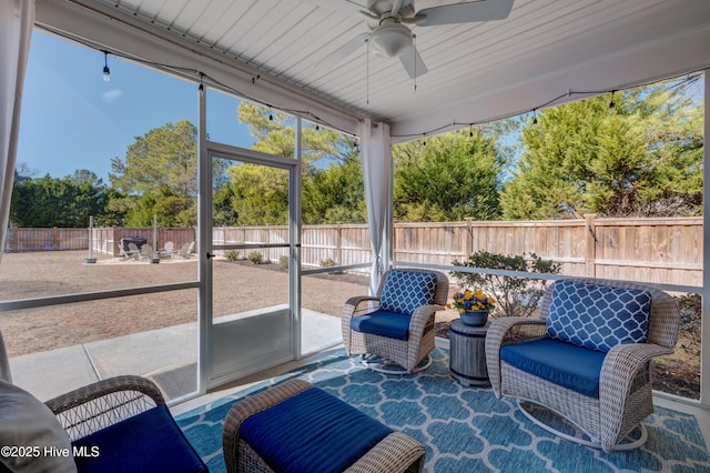 sunroom / solarium with ceiling fan