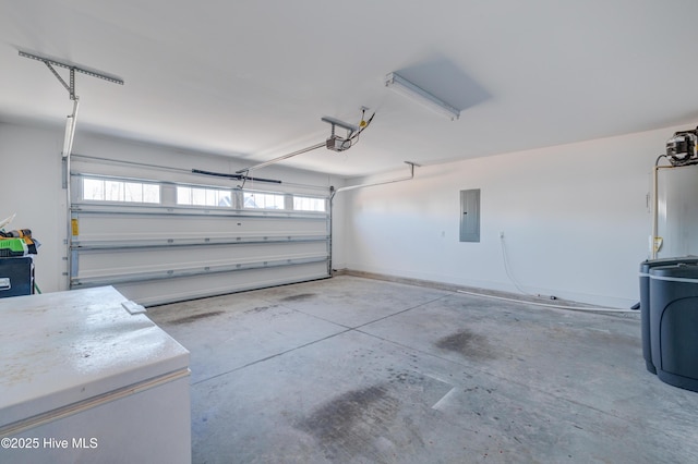 garage featuring a garage door opener, gas water heater, and electric panel