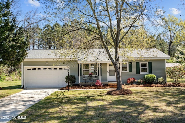 ranch-style home featuring a porch, a garage, and a front lawn