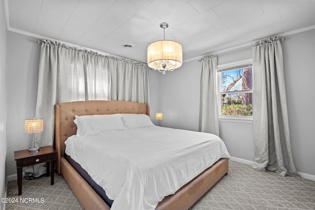 carpeted bedroom featuring ornamental molding