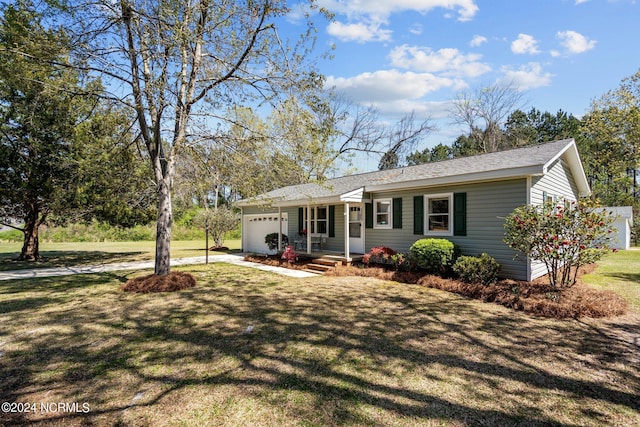 single story home featuring a garage and a front yard