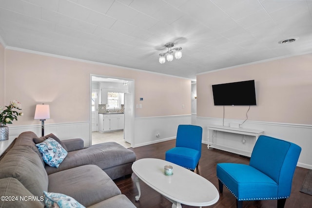 living room featuring crown molding and hardwood / wood-style floors