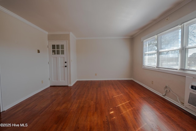 unfurnished room featuring crown molding and dark hardwood / wood-style floors