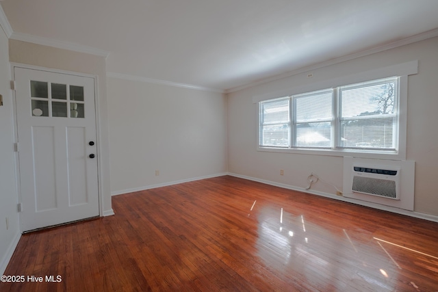 entrance foyer featuring crown molding, a wall mounted air conditioner, and dark wood-type flooring